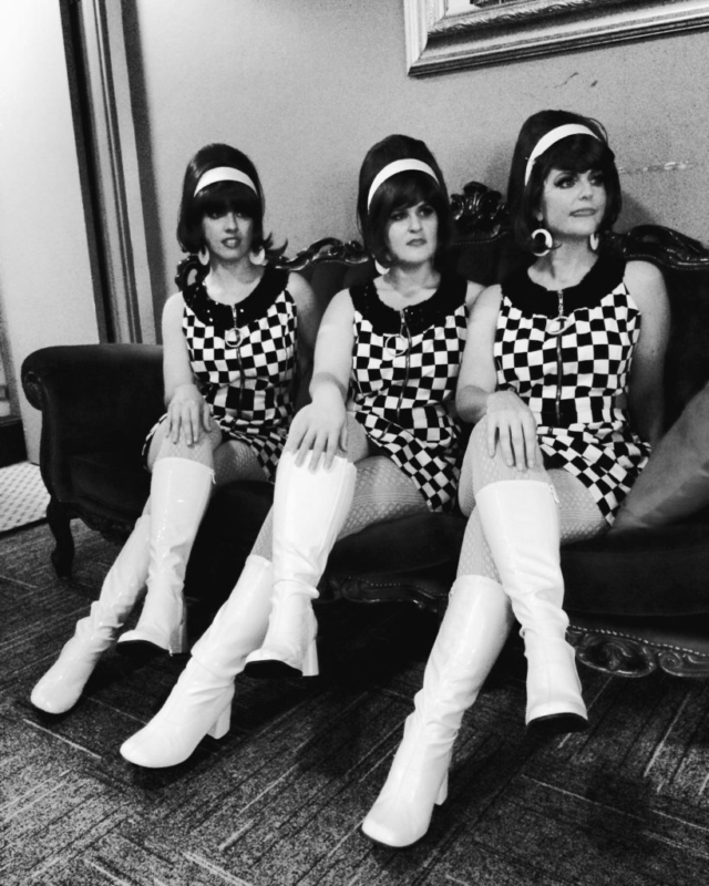 Monochrome image of the girls in checker dresses